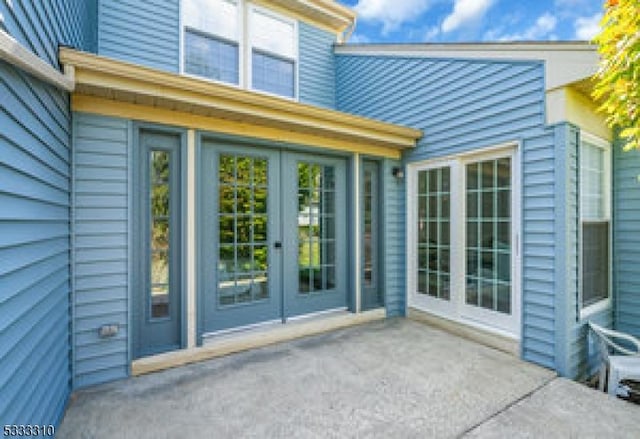 doorway to property with a patio area and french doors