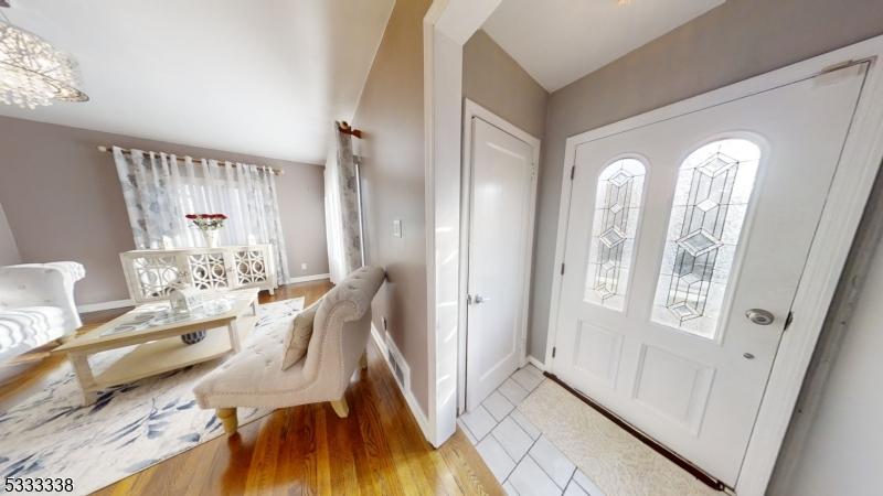 foyer entrance with light hardwood / wood-style flooring