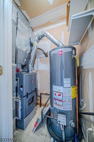 utility room with gas water heater