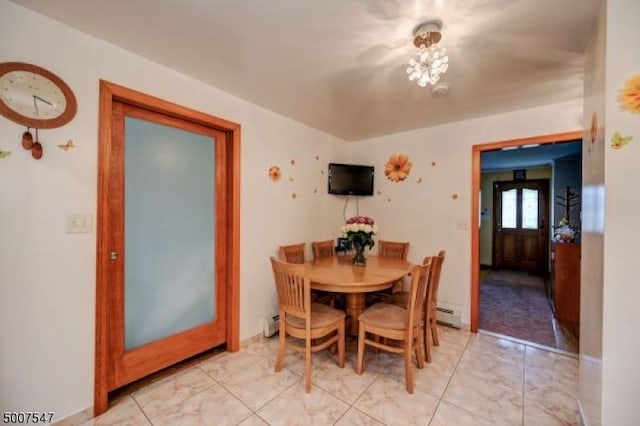 dining space featuring baseboard heating