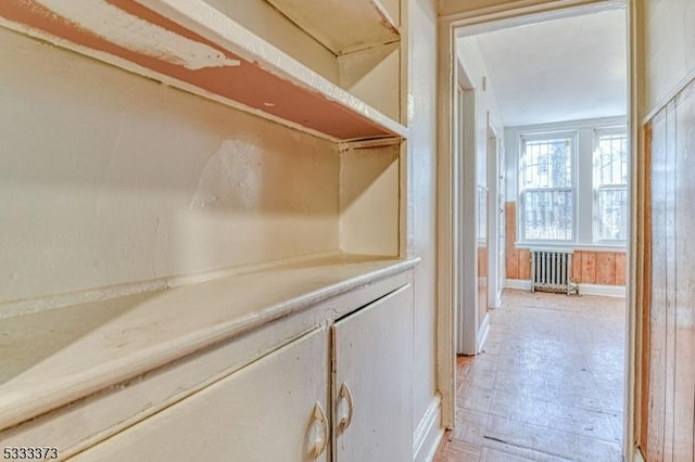 hallway featuring radiator heating unit