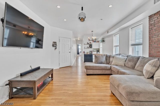 living room with light hardwood / wood-style floors