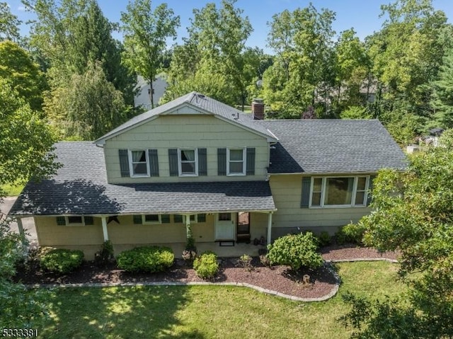 tri-level home with a front yard