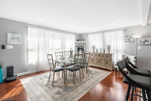 dining area featuring dark wood-type flooring