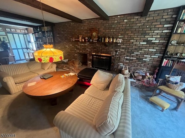 living room featuring a brick fireplace, brick wall, and beamed ceiling