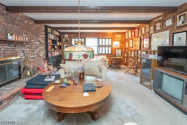 4 Webster Rd, Franklin Twp, NJ 08873 - living room featuring a brick fireplace, beam ceiling, brick wall, wooden walls, and carpet