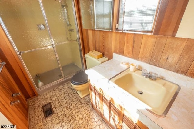 4 Webster Rd, Franklin Twp, NJ 08873 - bathroom featuring a stall shower, wooden walls, toilet, and vanity