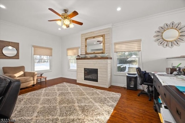 office space with dark hardwood / wood-style flooring, plenty of natural light, and ornamental molding