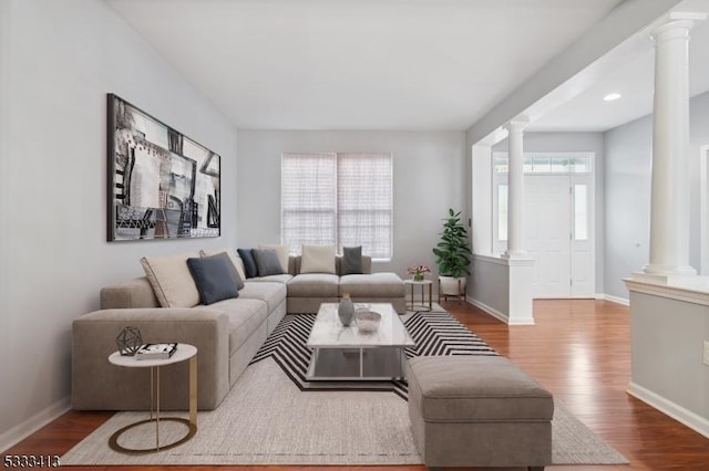 30 Stirrup Ln, Raritan Twp, NJ 08822 - living area featuring wood finished floors, baseboards, and decorative columns