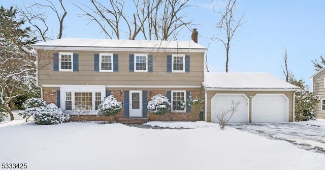 colonial inspired home with a garage