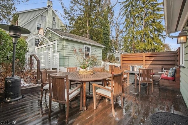 wooden terrace featuring an outdoor structure