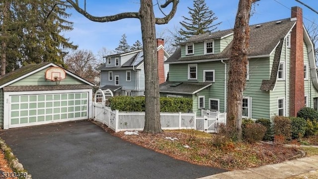 view of front of home with an outbuilding and a garage