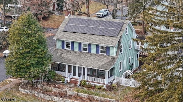 view of front of property featuring solar panels