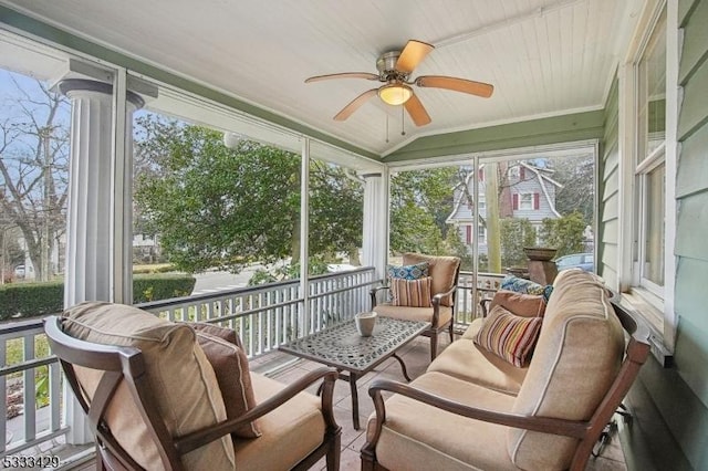 sunroom featuring ceiling fan