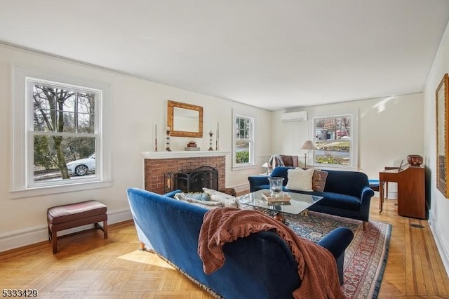 living room with a wall mounted air conditioner, a brick fireplace, and light parquet floors