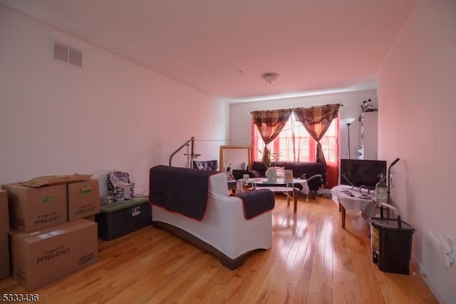 living room with light hardwood / wood-style flooring