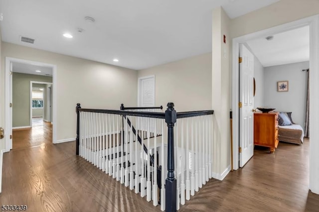 hallway featuring dark hardwood / wood-style flooring