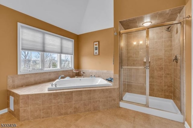 bathroom with tile patterned floors, lofted ceiling, and shower with separate bathtub