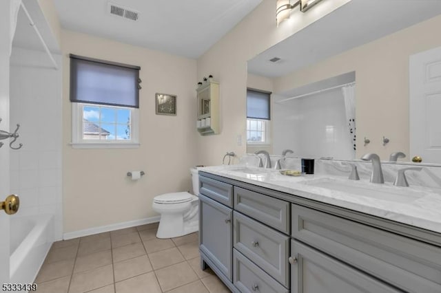 full bathroom with toilet, vanity, shower / tub combo, and tile patterned flooring