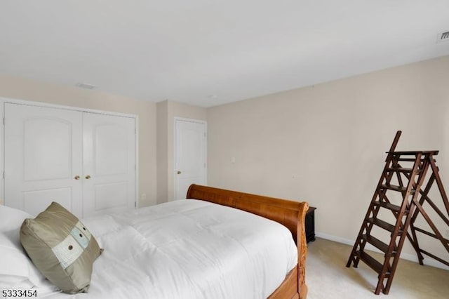 carpeted bedroom featuring a closet