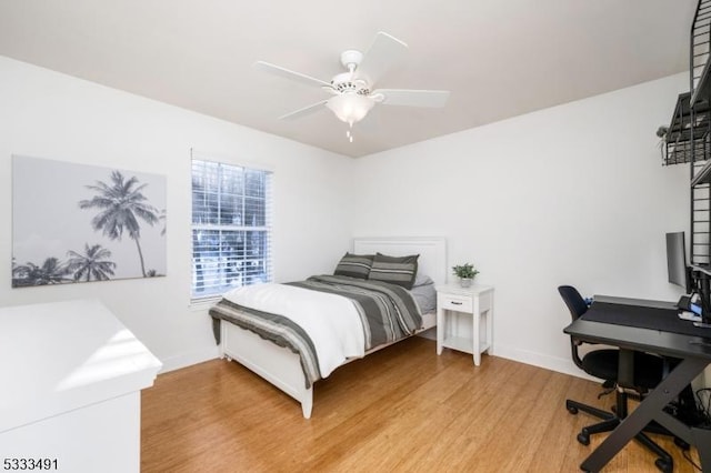 bedroom featuring ceiling fan and wood-type flooring