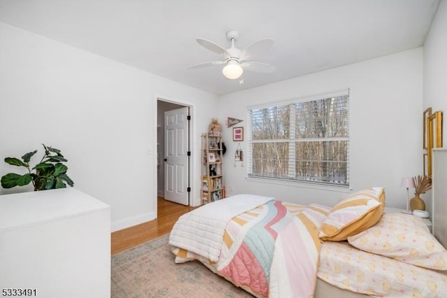 bedroom featuring ceiling fan and light wood-type flooring