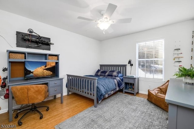 bedroom with light wood-type flooring and ceiling fan