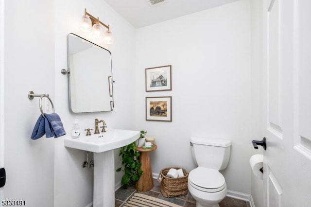 bathroom with sink and toilet