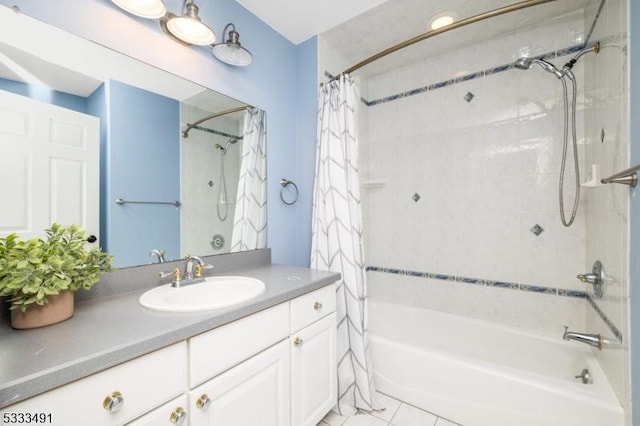 bathroom with vanity, tile patterned flooring, and shower / bath combo