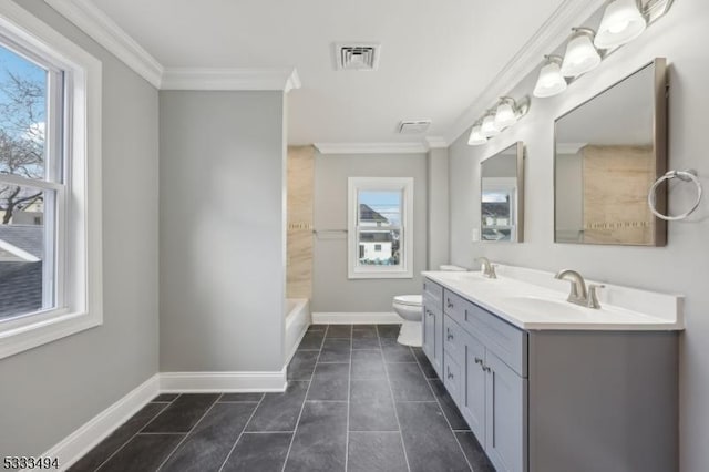 bathroom featuring a wealth of natural light, tile patterned floors, toilet, and ornamental molding