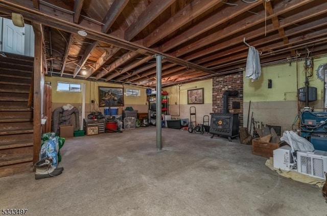 basement featuring a wood stove