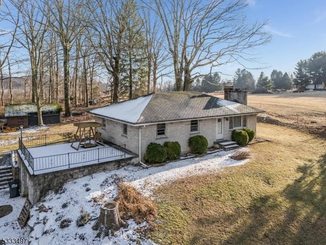 view of side of home featuring a deck