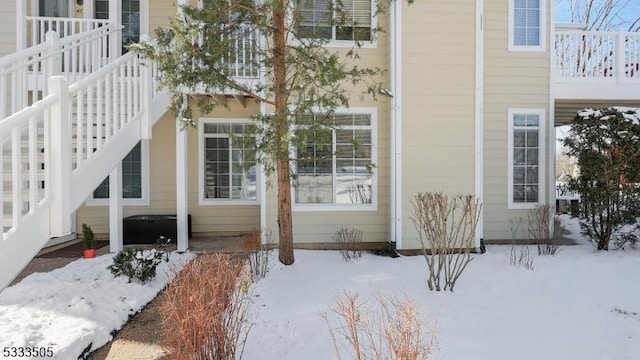 view of snow covered property entrance