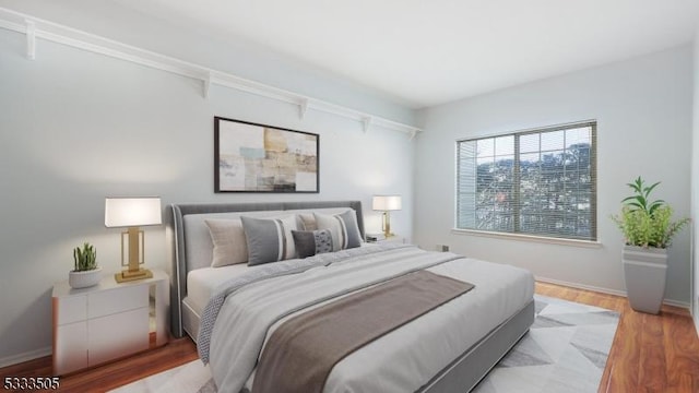 bedroom with light hardwood / wood-style flooring