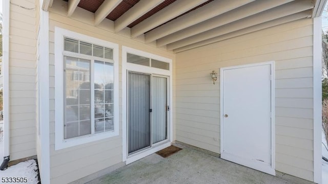 entrance to property featuring a patio area