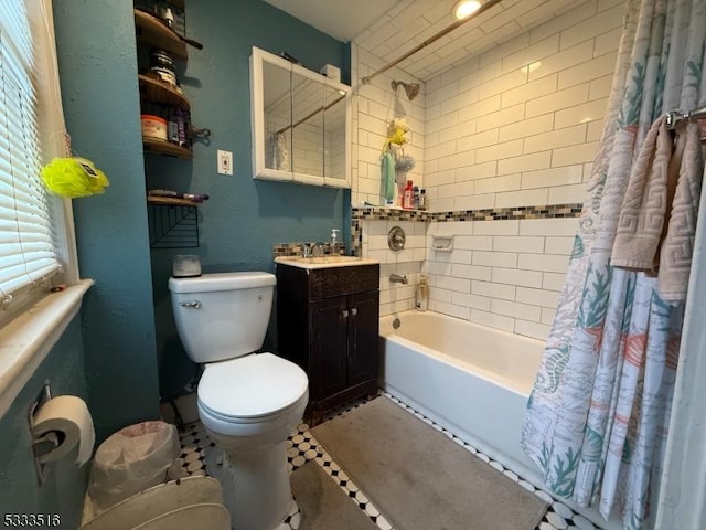 full bathroom with toilet, shower / bathtub combination with curtain, and vanity