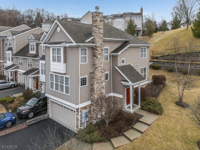 view of side of home with a garage