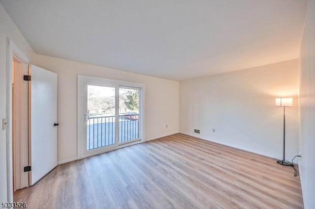 unfurnished room featuring light wood-type flooring