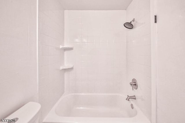 bathroom featuring toilet and shower / bathtub combination