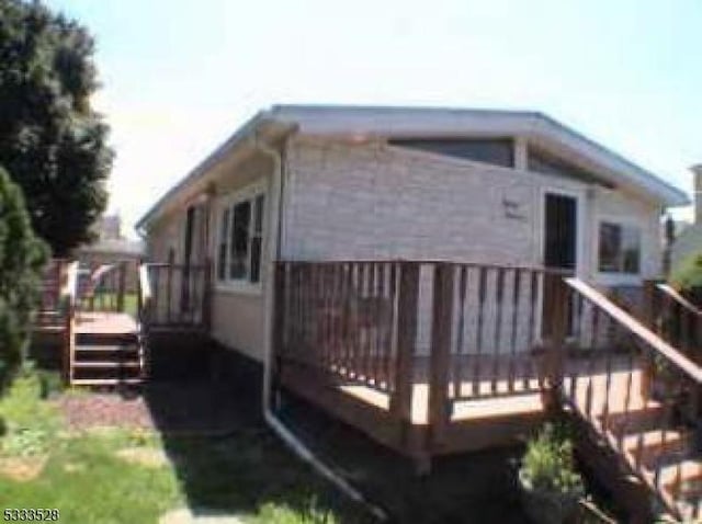 view of side of home featuring a deck