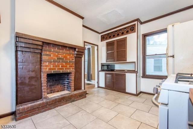 kitchen with white range with gas stovetop, light tile patterned floors, crown molding, and a fireplace