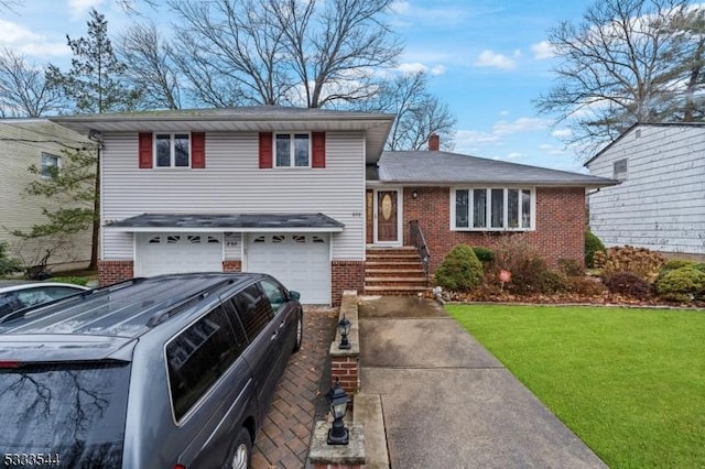 tri-level home with a garage and a front yard