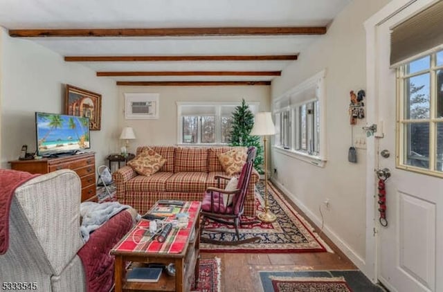 living room with beamed ceiling and hardwood / wood-style floors