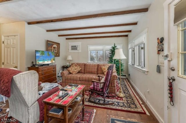 living room featuring a wall mounted air conditioner, hardwood / wood-style floors, and beam ceiling