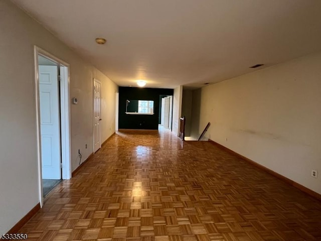 hallway with parquet flooring