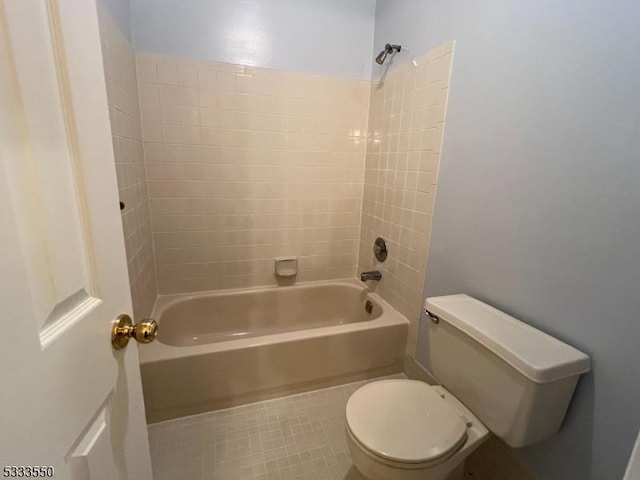 bathroom with toilet and shower / bath combination