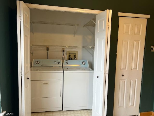 laundry area featuring washer and clothes dryer