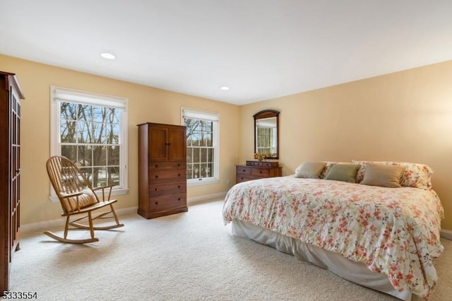 bedroom featuring light colored carpet