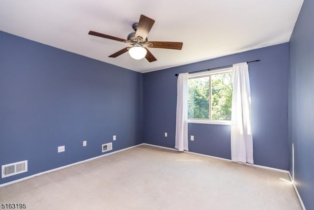 unfurnished room with carpet flooring and ceiling fan