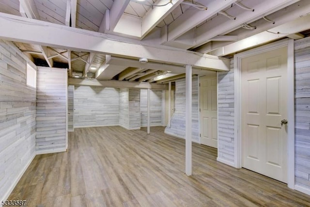 basement featuring hardwood / wood-style floors